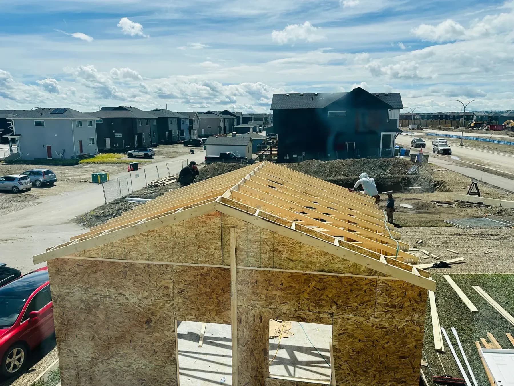 A Pama Homes garage roof being framed and sheathed, seen from above